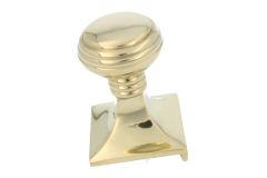 Door knob polished brass. Screw located on the interior side