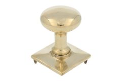 Round door Knob on square rosette polished brass